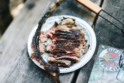 High angle view of meat in plate on table