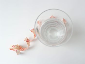 High angle view of stuffed toy over white background