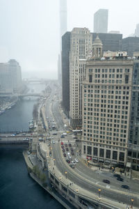 Big city skyline and architecture with falling snow