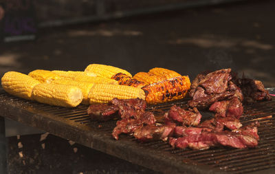Close-up of meat on barbecue grill