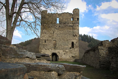 Old ruin building against cloudy sky