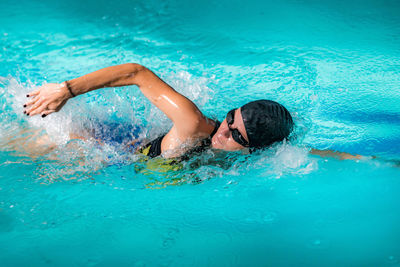 High angle view of man swimming in pool