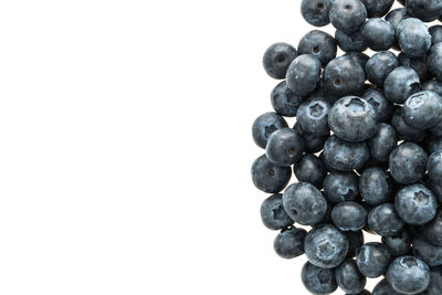 Close-up of blueberries against white background