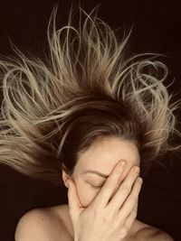 Close-up portrait of a beautiful young woman with eyes closed