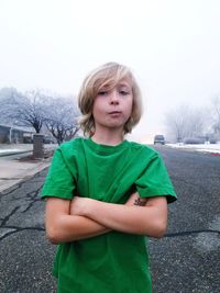 Boy on snow covered landscape