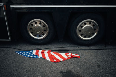 Close-up of red flag on road in city