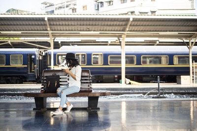 Full length of woman at railroad station