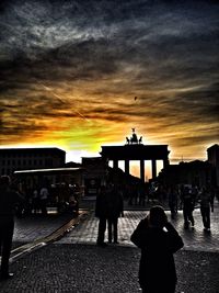 Silhouette of people at sunset