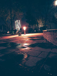 View of illuminated street at night