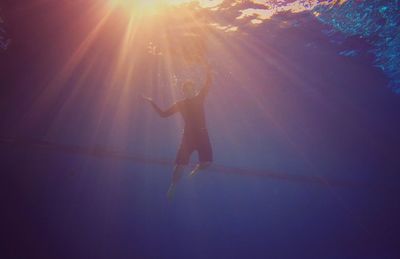 Full length of a man underwater