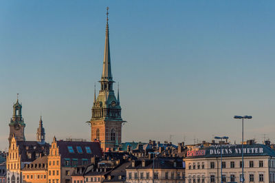 Low angle view of buildings against blue sky