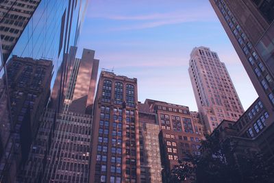 Low angle view of modern buildings against sky