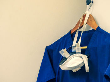 Close-up of clothes hanging on wall