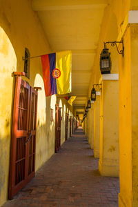 Colombian flags in corridor of historic building