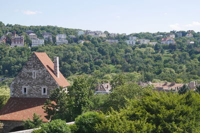 High angle view of trees and buildings against sky