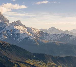 Scenic view of snowcapped mountains against sky