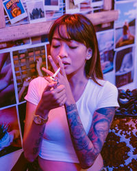 Young woman smoking cigarette