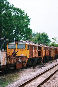 Train on railroad track against sky