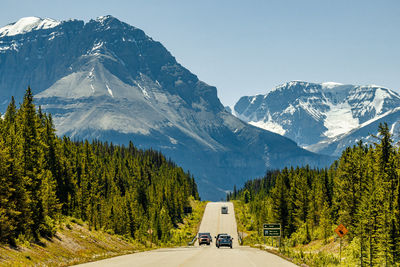 Scenic view of snowcapped mountains against clear sky