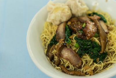 Close-up of noodles in bowl on table
