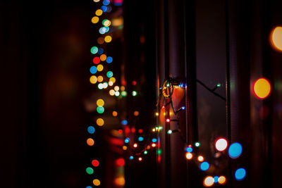 Defocused image of illuminated christmas tree at night