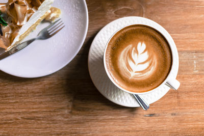 High angle view of cappuccino on table