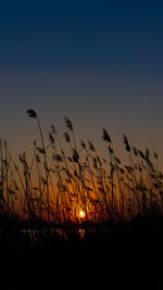 Silhouette landscape against sky during sunset