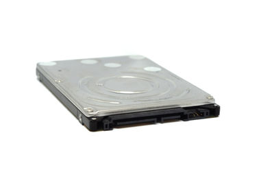 High angle view of piano keys against white background