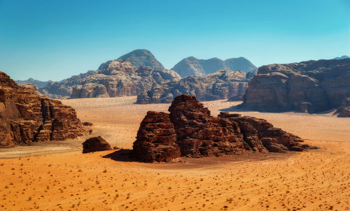 Rock formations in desert against clear sky