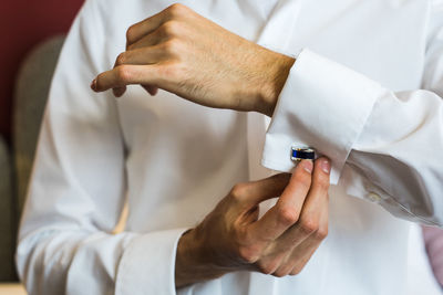 Close-up of man holding hands