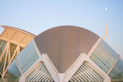 Low angle view of modern buildings against clear blue sky