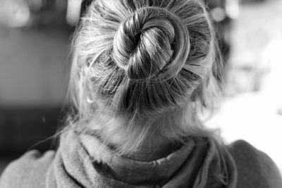 Close-up of woman with hair bun 