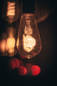 Close-up of illuminated light bulb