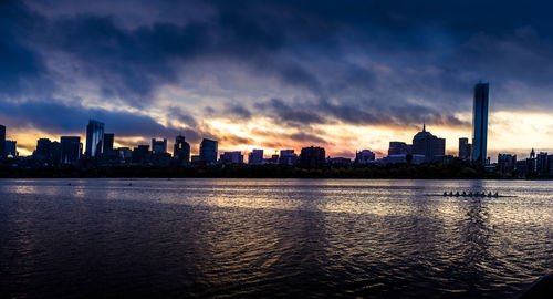 Buildings in city at sunset