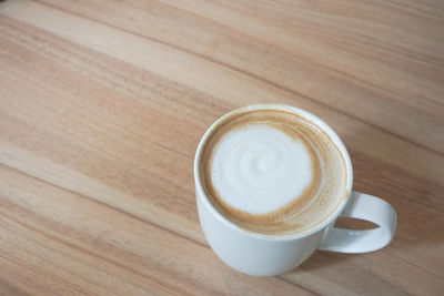 High angle view of cappuccino on table