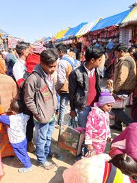 People on street market in city