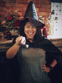 Woman wearing witch costume during halloween