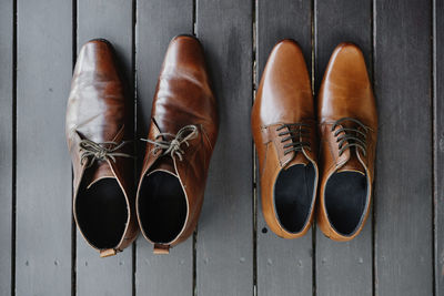 Close-up of shoes on wooden planks