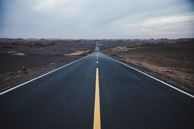 Empty road along landscape