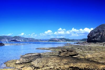 Scenic view of sea against blue sky