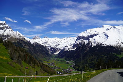 Scenic view of snowcapped mountains against sky