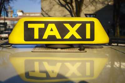 Close-up of taxi sign