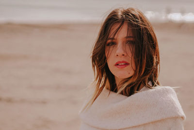 Portrait of woman standing on beach