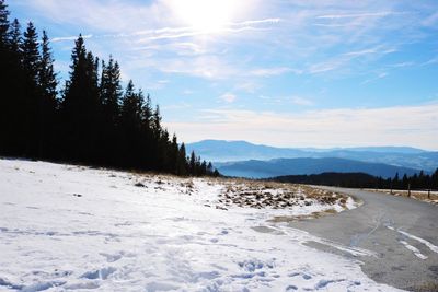 Scenic view of snowcapped mountains against sky