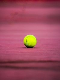 Close-up of tennis ball on table