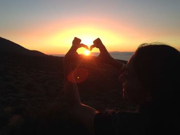 People photographing at sunset