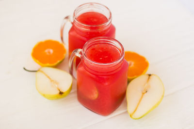 High angle view of fruits in jar on table