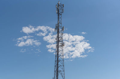 Low angle view of communications tower against sky