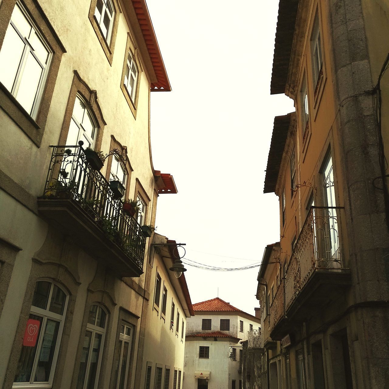 LOW ANGLE VIEW OF RESIDENTIAL BUILDINGS IN TOWN