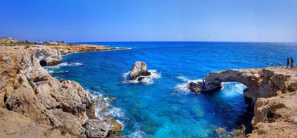 Scenic view of sea against clear blue sky